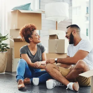 Young couple taking a break while they move into their new home